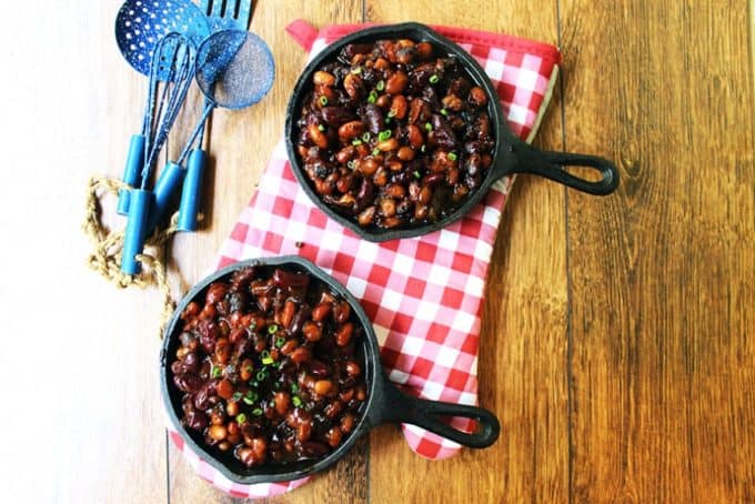 Baked Beans in two small skillets ready to serve