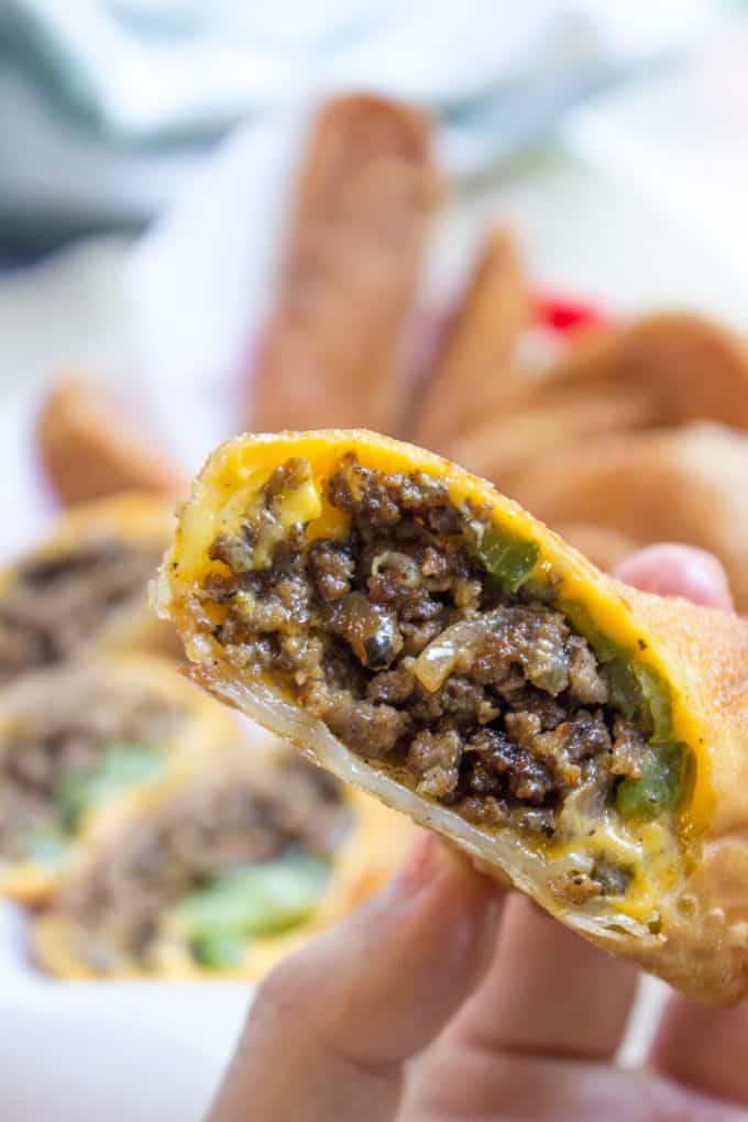 Cheesesteak egg rolls have all the flavors of the classic Philly Cheese Steak Sandwich in a crispy shell and made with ground beef! So easy to make and they taste...AMAZING.