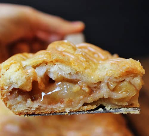 A flaky crust, tender apples, warm spices, it's a delicious handheld pie in slab form, which means you get more crust per bite! It is topped with all the flavors in the pie because it uses all the leftover spiced liquids from the apples!