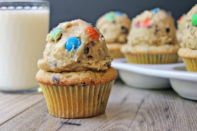 Chocolate Chip Peanut Butter Cupcakes topped with Monster Cream Cheese Cookie Dough Frosting! Full of M&Ms, peanut butter, brown sugar, oats and chocolate chips. Heaven in a bite!