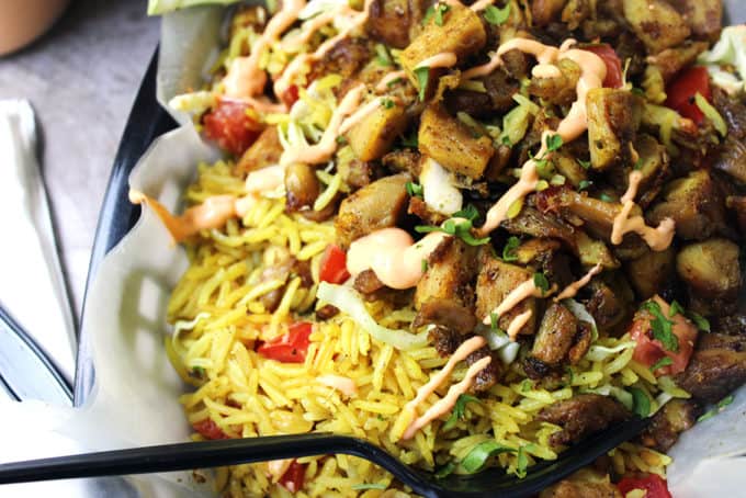 Halal Cart's boldly flavored Middle Eastern Chicken and fragrant Turmeric Rice with a spicy yogurt sauce.