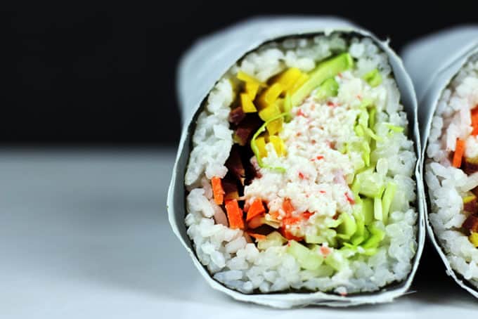 Try the trend taking over the Bay Area in California! Sushi gets supersized with an imitation crab meat sushi burrito that is filled with imitation crab, cucumber, avocado, carrots and napa cabbage. Serve with spicy mayo, and soy sauce and laugh at all the normal sized california rolls people are still eating.