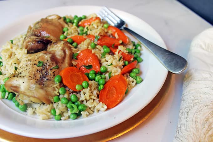 One pan easy baked Chicken & Brown Rice Casserole served with Carrots and Peas. Healthy, flavorful and almost no clean-up involved!