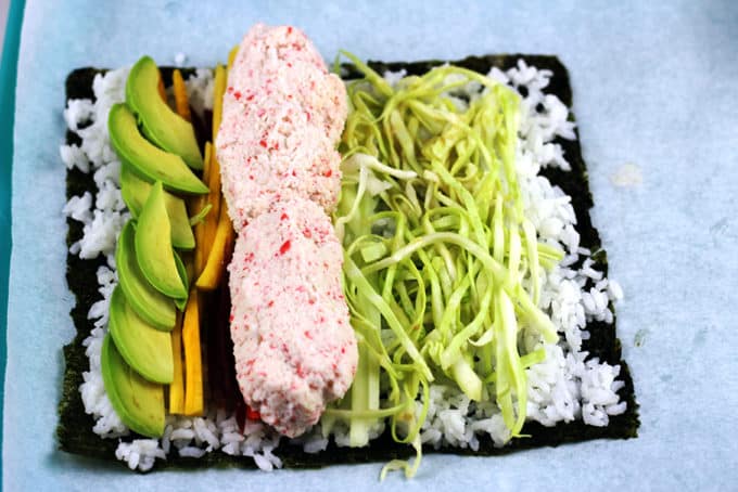 Try the trend taking over the Bay Area in California! Sushi gets supersized with an imitation crab meat sushi burrito that is filled with imitation crab, cucumber, avocado, carrots and napa cabbage. Serve with spicy mayo, and soy sauce and laugh at all the normal sized california rolls people are still eating.