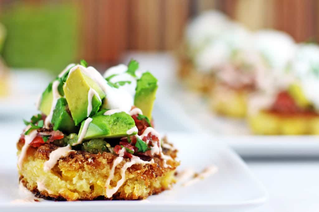 Cheesecake Factory Corn Cakes are tender, buttery corn cakes topped with tomatillo salsa, pico de gallo, southwestern sauce, avocados, cilantro and sour cream! A Cheesecake Factory favorite brought into your own kitchen.