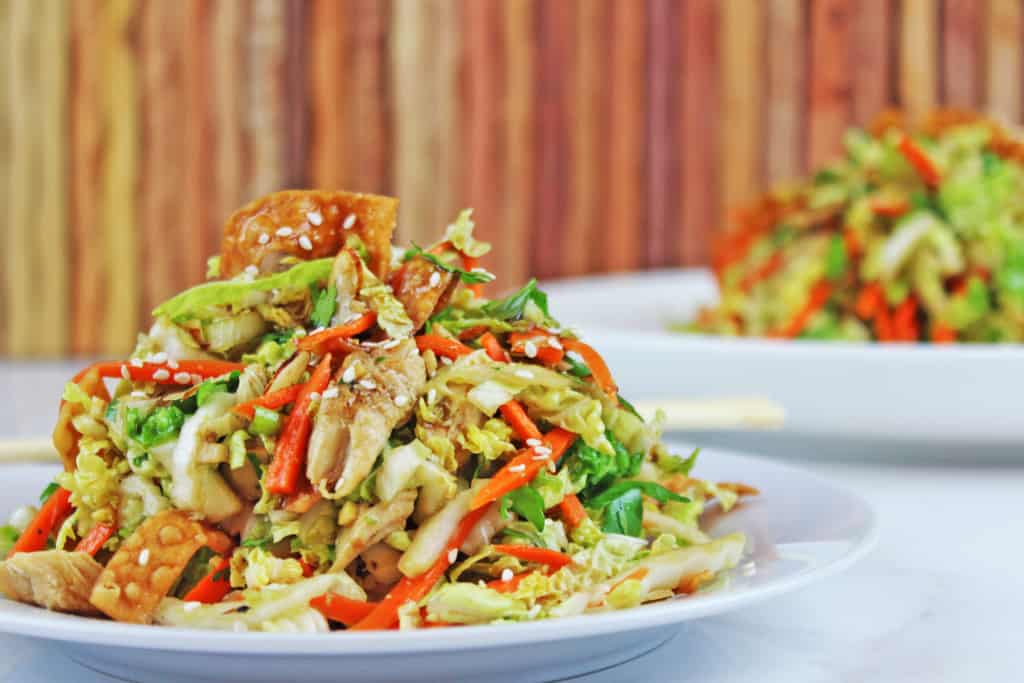 Chinese Salad with cabbage and carrots on white serving plate 