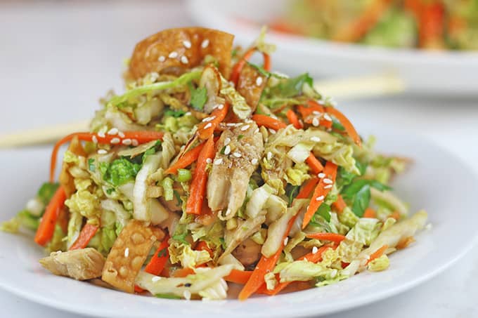 Lightly dressed Chinese Chicken Salad with grilled chicken, crunchy wontons, toasted almond and sprinkled with sesame seeds over a crunchy napa cabbage and carrot salad. Done in 15 minutes!