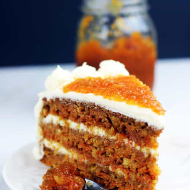 Luscious (nut free) carrot cake made with pineapple and filled with homemade carrot cake jam and cream cheese frosting. Instructions included for making extra layers too. This is the ultimate in carrot cakes and a perfect holiday dessert!