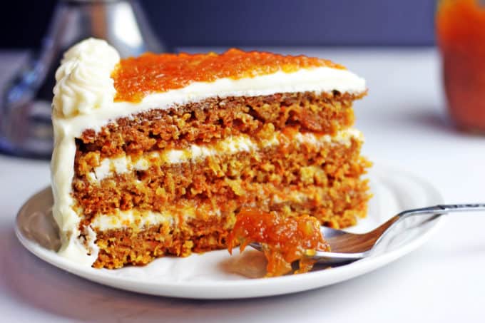 Luscious (nut free) carrot cake made with pineapple and filled with homemade carrot cake jam and cream cheese frosting. Instructions included for making extra layers too. This is the ultimate in carrot cakes and a perfect holiday dessert!