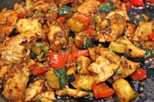 Full of Spicy Wok fired Chicken Breast, Zucchini, Red Bell Peppers and crunchy Peanuts in a Sesame Ginger-Garlic Sauce, this recipe is Authentically Panda Express! The recipe is straight from the source! http://archives.starbulletin.com/2007/01/17/features/story01.html BACK TO TOP art CRAIG T. KOJIMA / CKOJIMA@STARBULLETIN.COM Panda Express customer favorite Kung Pao Chicken. CLICK FOR LARGE Kung Pao Chicken is tasty, too No luck getting that Orange Chicken recipe, but Panda was willing to part with another of its top dishes. Kung Pao Chicken 1 pound boneless, skinless chicken breast, diced into 1/2-inch pieces, rinsed and drained 1 teaspoon cooking wine 2-1/2 tablespoons soy sauce 1/3 cup water 2-1/2 tablespoons vegetable oil, divided use 12 whole dry chili peppers (smaller than 3 inches; if longer, cut in half) 1/4 cup diced green onion, white part only, in 1/2-inch pieces 1 teaspoon ground ginger 1 teaspoon ground garlic 1 teaspoon crushed red chili pepper 1/2 tablespoon cornstarch mixed with 1/2 tablespoon water 1 teaspoon sesame oil 2 ounces dry roasted peanuts » Marinade: 1/4 cup water 1/2 teaspoon salt 1/2 egg 1/4 cup cornstarch 2 tablespoons vegetable oil Combine marinade ingredients. Add chicken; refrigerate at least 1 hour. Combine wine, soy sauce and water; set aside. Heat wok on high heat 10 seconds. Add 2 tablespoons oil and heat well. Remove chicken from marinade and add to wok. Stir-fry quickly, 60 seconds. Remove chicken; drain well. Add chili peppers. Stir-fry until they darken. If wok becomes too dry, add 1/2 tablespoon vegetable oil. Add green onions, ginger, garlic and crushed red chili pepper. Stir-fry 5 seconds. Return chicken to wok; stir soy sauce/wine mixture and add; stir until sauce boils, then add cornstarch mix to thicken. Add sesame oil and peanuts. Stir and fold until ingredients are thoroughly mixed. Serves 3.