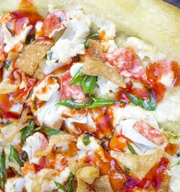 This Crab Wonton Pizza with Sweet & Sour Drizzle is the answer to "Pizza or Chinese?" and in the best possible way because you can make it at home! Crunchy, creamy, sweet and sour you'll find yourselves fighting over the last slice!