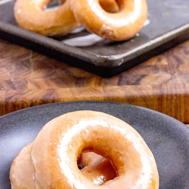 The Original Krispy Kreme Glazed Yeast Doughnut you know and love and now you can make them at home and eat them fresh! These doughnuts are best right after the glaze dries!