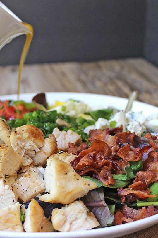 Cosi Cobb Salad with grilled chicken, bacon, eggs, gorgonzola and more topped with Cosi's signature Sherry Shallot Vinaigrette dressing.