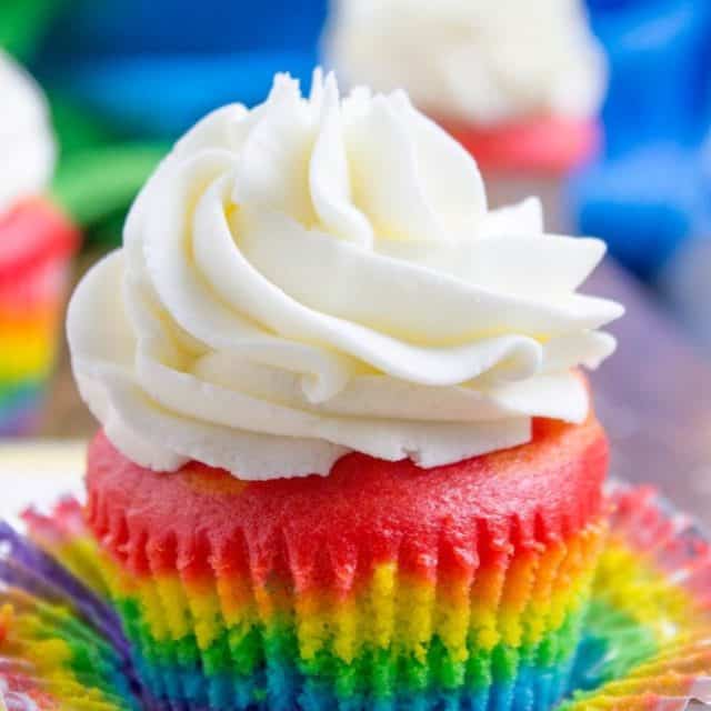 Rainbow Cupcakes with fluffy cloud-like vanilla frosting that is guaranteed to make anyone who sees them smile. No cake mix, still EASY.