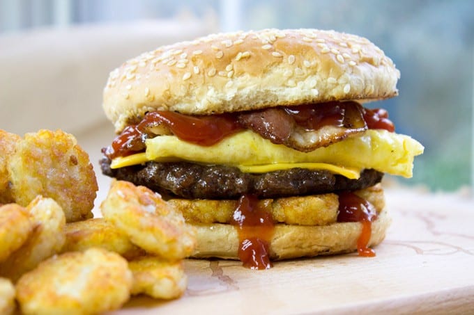 Carl's Jr. Breakfast Burger with seared beef patty, crispy hash browns, scrambled eggs, cheese and glorious bacon. All the flavor, no drive-thru.