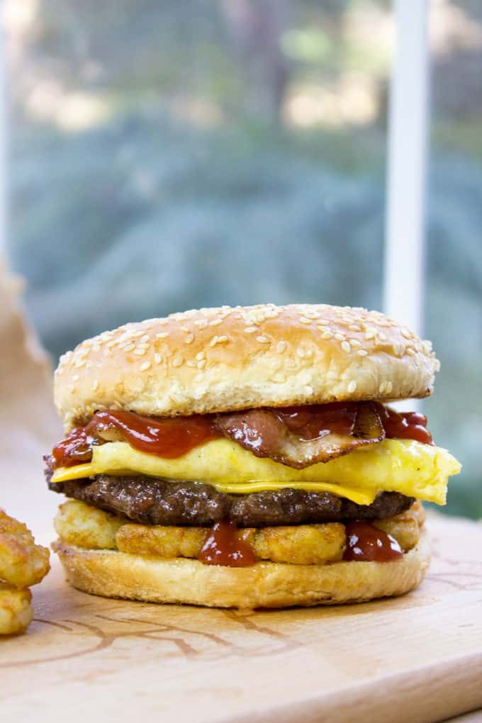 Carl's Jr. Breakfast Burger with seared beef patty, crispy hash browns, scrambled eggs, cheese and glorious bacon. All the flavor, no drive through.