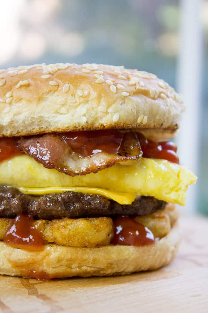 Carl's Jr. Breakfast Burger with seared beef patty, crispy hash browns, scrambled eggs, cheese and glorious bacon. All the flavor, no drive through.