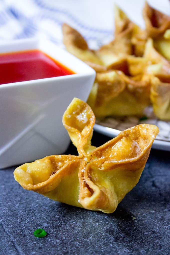 Cream Cheese Rangoon ready to dip in sweet and sour sauce
