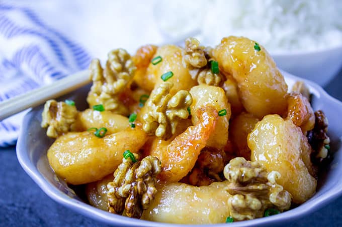 Panda Express Honey Walnut Shrimp are fried with a tempura batter and quickly tossed in a honey sauce and sweetened walnuts. 