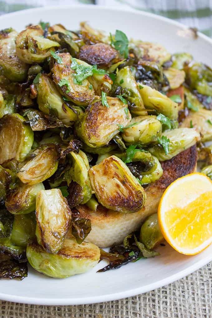 Tin Roof Bistro Brussels Sprouts are caramelized and tossed in a lemony caper butter sauce. The most popular item on the menu will make anyone a fan!