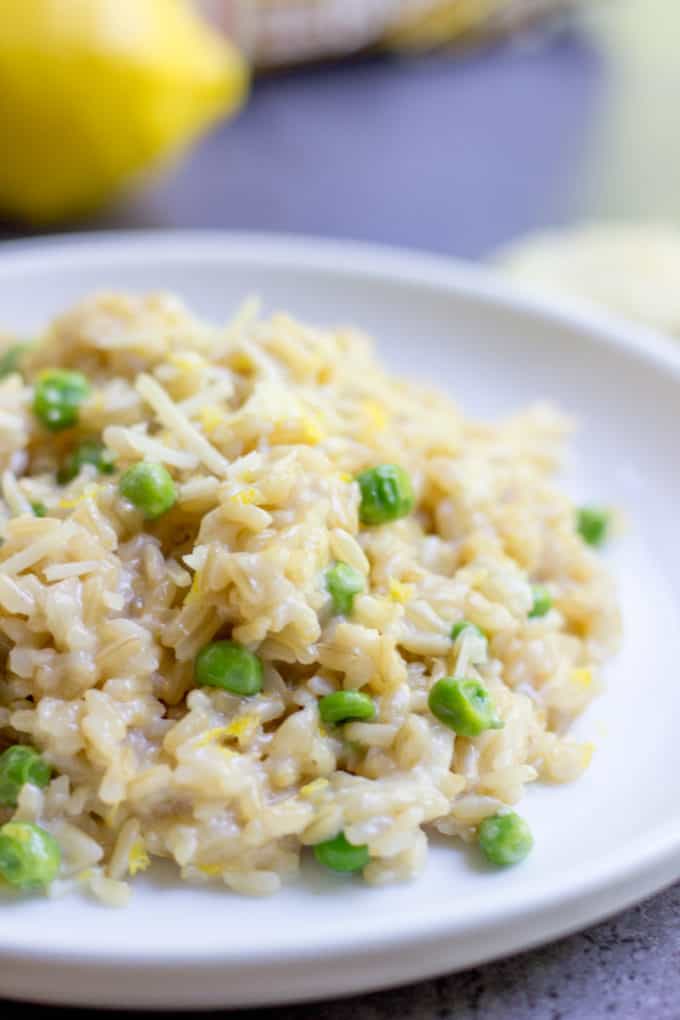 One Minute Brown Rice Risotto with garlic, peas and lemon makes the perfect on the go meal that feels like you spent all day in the kitchen in just one minute in the microwave.
