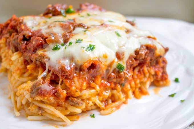 Baked Million Dollar Spaghetti is creamy with a melty cheese center, topped with meat sauce and extra bubbly cheese. Tastes like a cross between baked ziti and lasagna with half the effort!