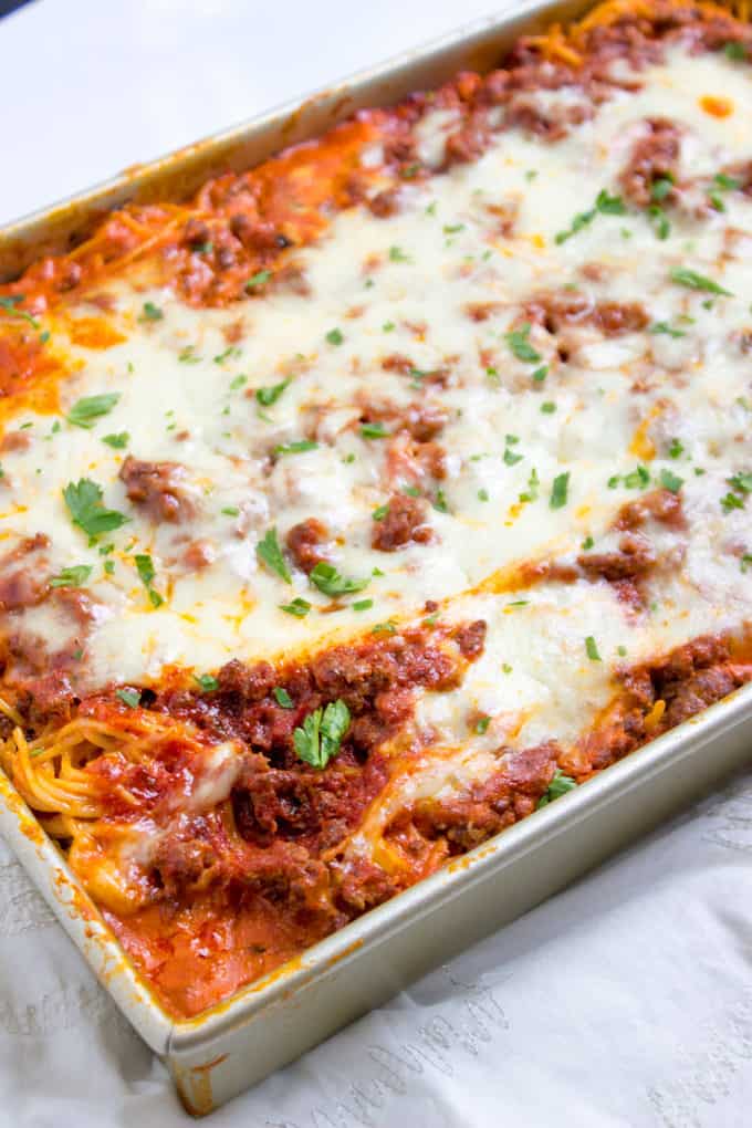 Baked Million Dollar Spaghetti is creamy with a melty cheese center, topped with meat sauce and extra bubbly cheese. Tastes like a cross between baked ziti and lasagna with half the effort!