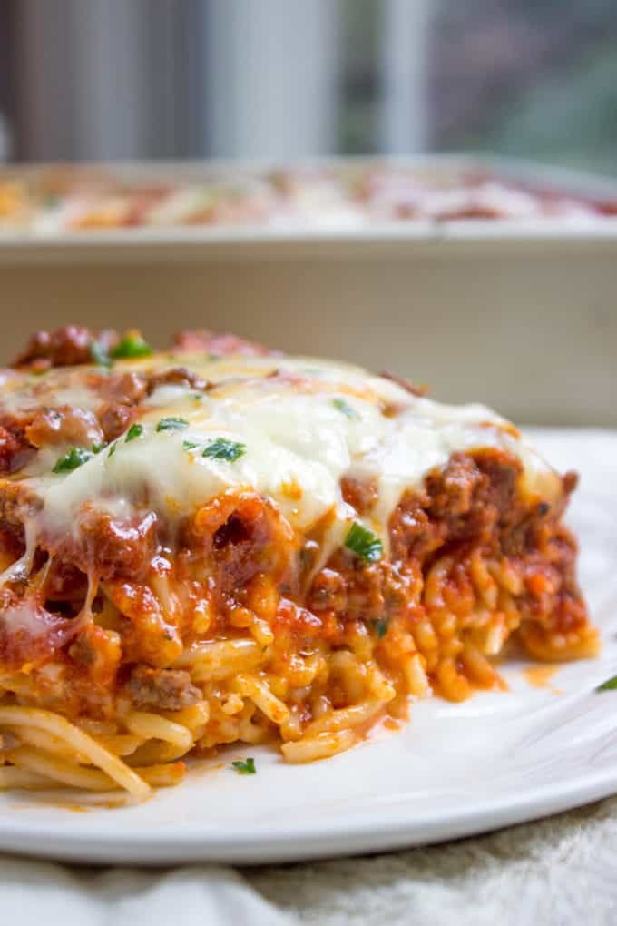 Baked Million Dollar Spaghetti is creamy with a melty cheese center, topped with meat sauce and extra bubbly cheese. Tastes like a cross between baked ziti and lasagna with half the effort!