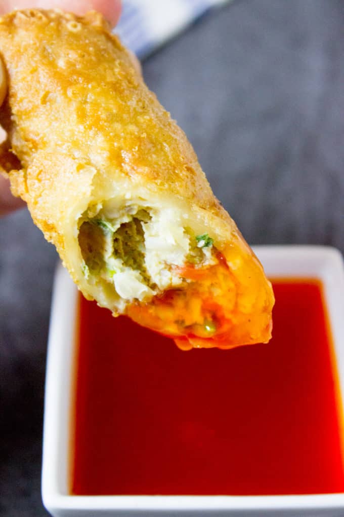Egg roll dipped in Sweet and Sour Sauce 