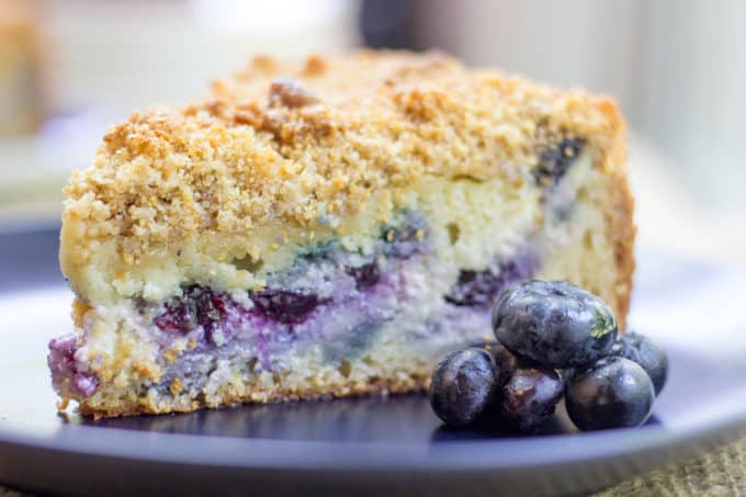 Blueberry Cream Cheese Coffee Cake with a tender center, creamy filling and a crunchy, buttery topping. A perfect mix of crumb coffee cake and cheesecake.