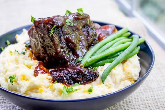 braised short ribs served with green beans and potatoes