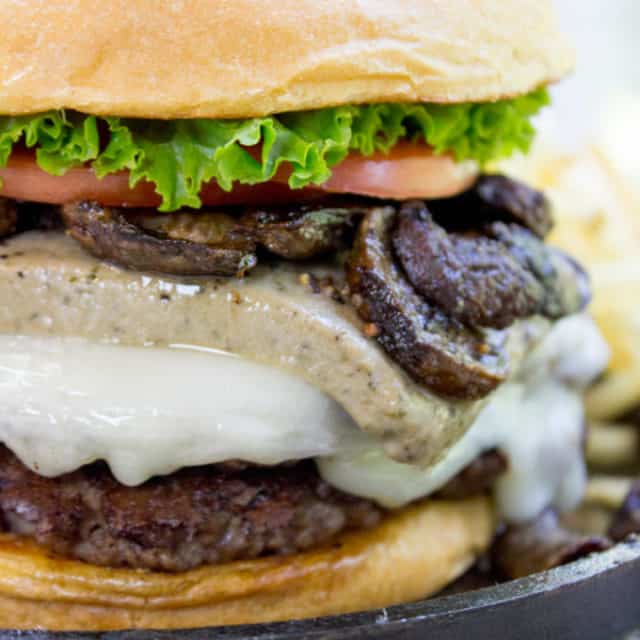 Truffle Mousse Burgers made at home with delicious truffle mousse, mushrooms and pepper crusted beef patties, this is the perfect indulgent burger for your summer cookout, graduation or Father's Day.