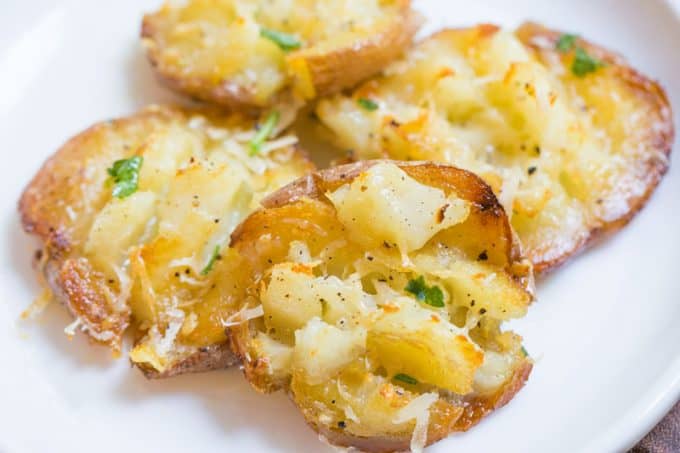 Parmesan Garlic Crash Hot Potatoes are crispy, creamy, cheesy and garlicky. Made in one pan and no boiling necessary, they're the perfect holiday side dish.
