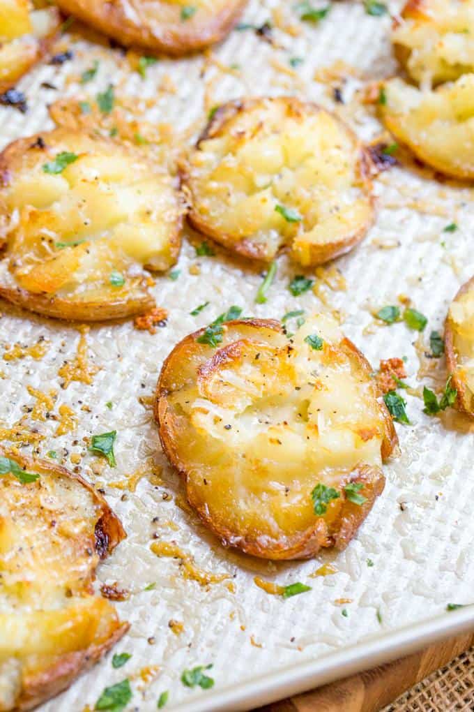 Parmesan Garlic Crash Hot Potatoes are crispy, creamy, cheesy and garlicky. Made in one pan, there is no boiling necessary and they make the perfect holiday side dish.