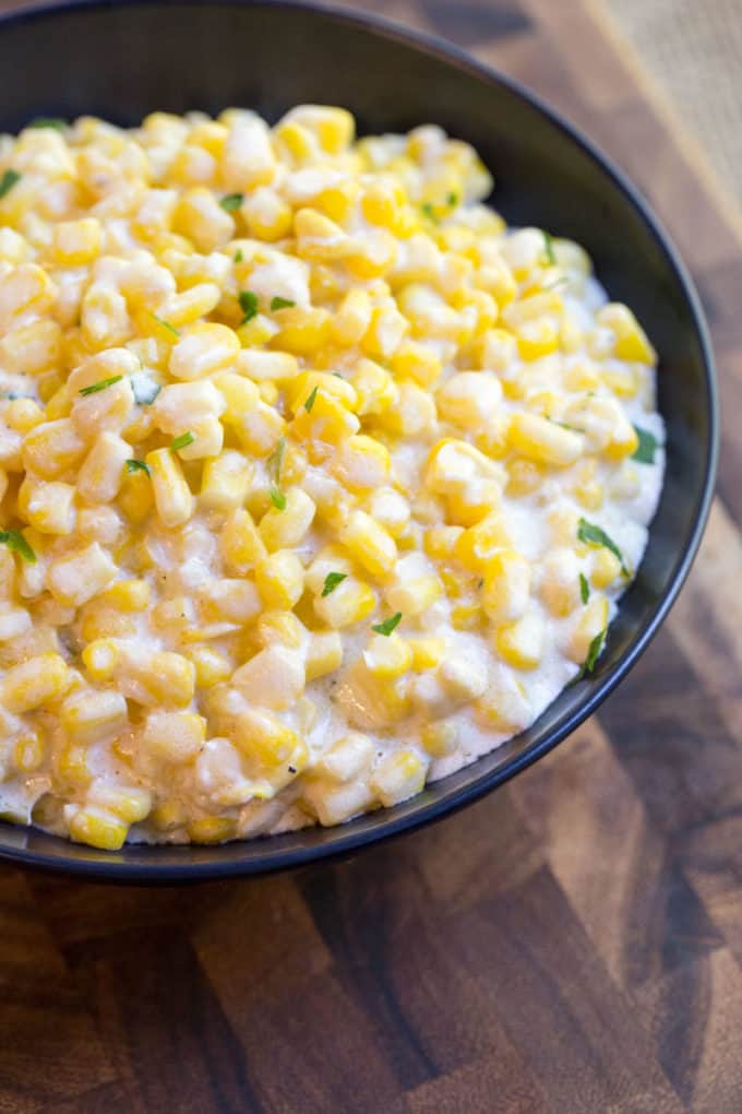 Creamed Corn served in black bowl