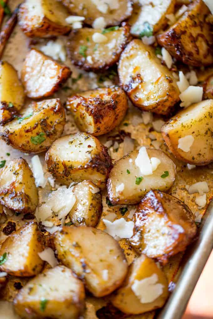 Parmesan Pesto Roasted Potatoes are ready for roasting in minutes with red potatoes, basil pesto, olive oil and Parmesan Cheese.