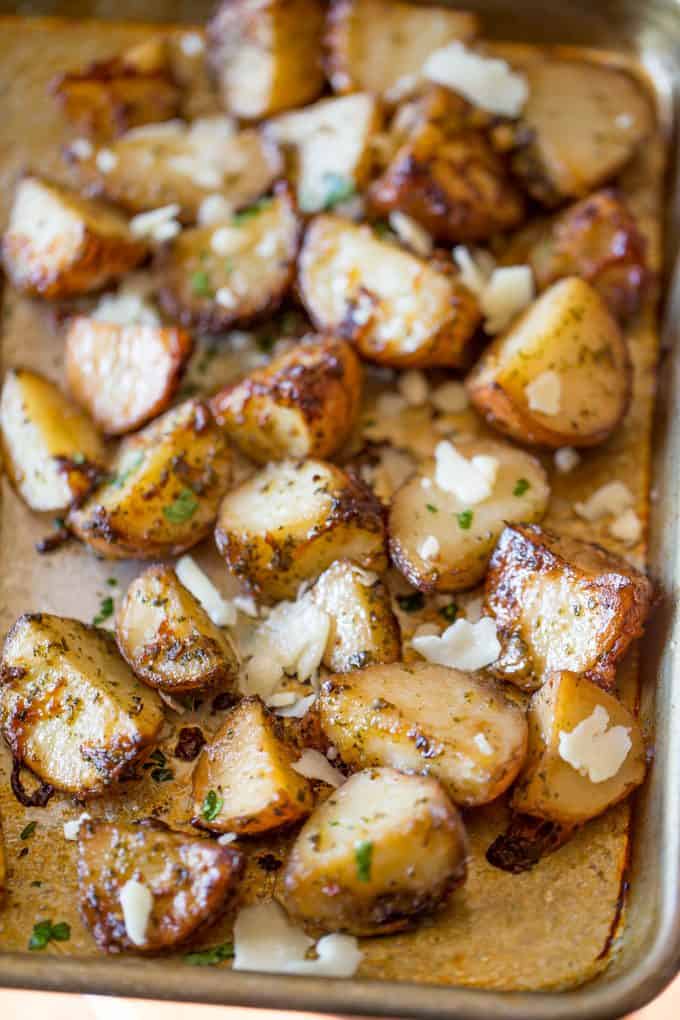 Parmesan Pesto Roasted Potatoes are ready for roasting in minutes with red potatoes, basil pesto, olive oil and Parmesan Cheese.