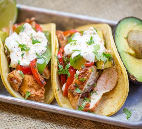 Slow Cooker Chicken Fajitas are made with homemade fajita seasoning mix, chicken, onions, bell peppers and fresh limes for the perfect easy weeknight meal.