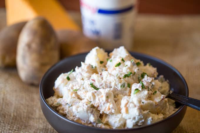 Loaded Baked Potato Salad is cheesy, creamy and ready in just minutes. It makes the perfect side dish to your holiday meal or potluck!