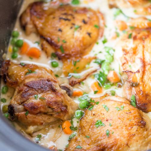 Slow Cooker Crispy Chicken Pot Pie with crispy chicken thighs and all your favorite pot pie vegetables cooked together to make a thick and creamy side dish to the chicken.