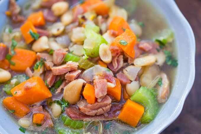 Slow Cooker Ham and White Bean Soup is the perfect recipe after your holiday ham when you want a cozy warm soup to help you recover from holiday cooking!