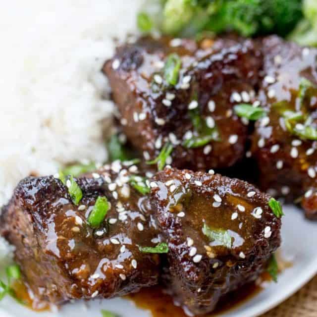 Slow Cooker Korean Short Ribs browned and cooked until fork tender with just a few minutes of prep work and all your favorite flavors.