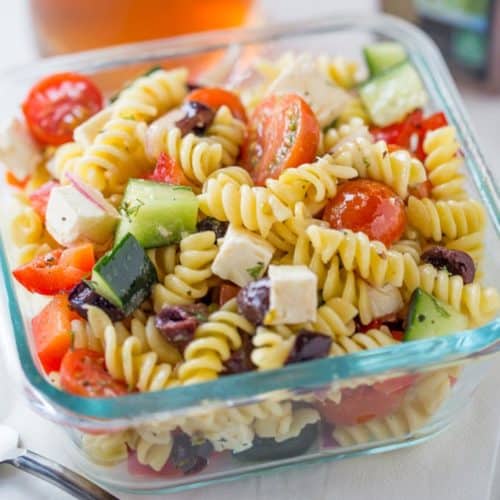 Easy Greek Pasta Salad with a homemade vinaigrette, pasta, feta, and olives is the perfect, easy lunch meal you can enjoy at room temperature. Also great with added chicken or shrimp.