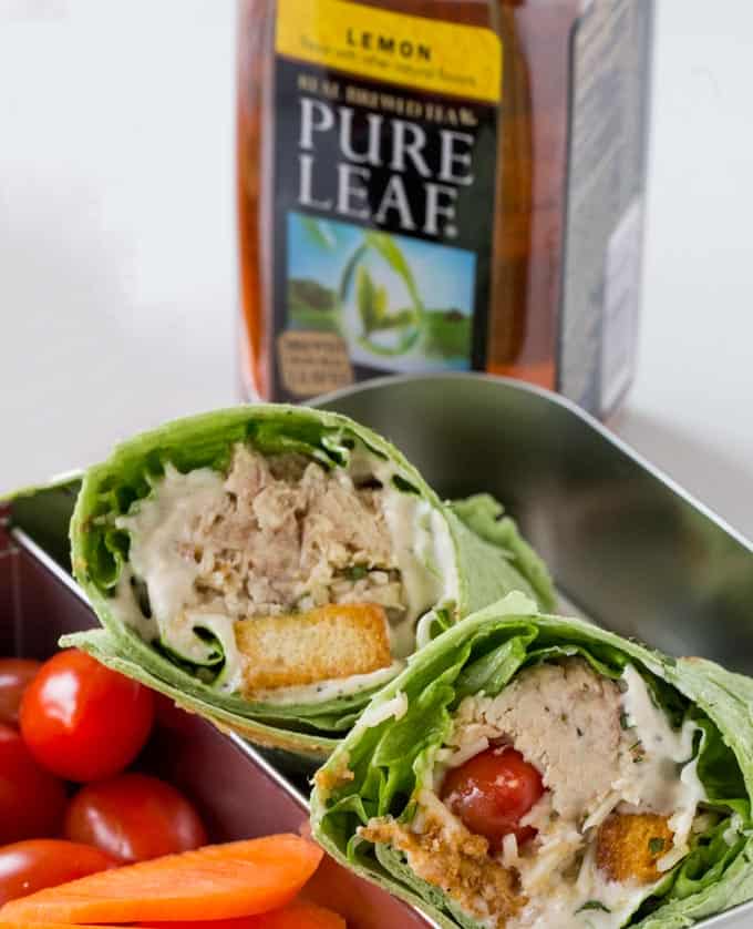 Slow Cooker Chicken Caesar Wrap with shredded chicken, an easy anchovy free caesar dressing, croutons, tomatoes and Parmesan cheese in a spinach tortilla.