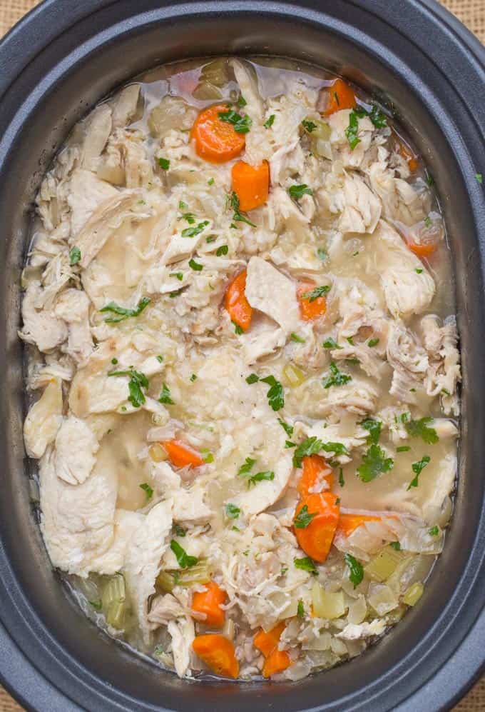Slow Cooker Chicken and Rice Soup with lemon, brown rice and chicken breasts.