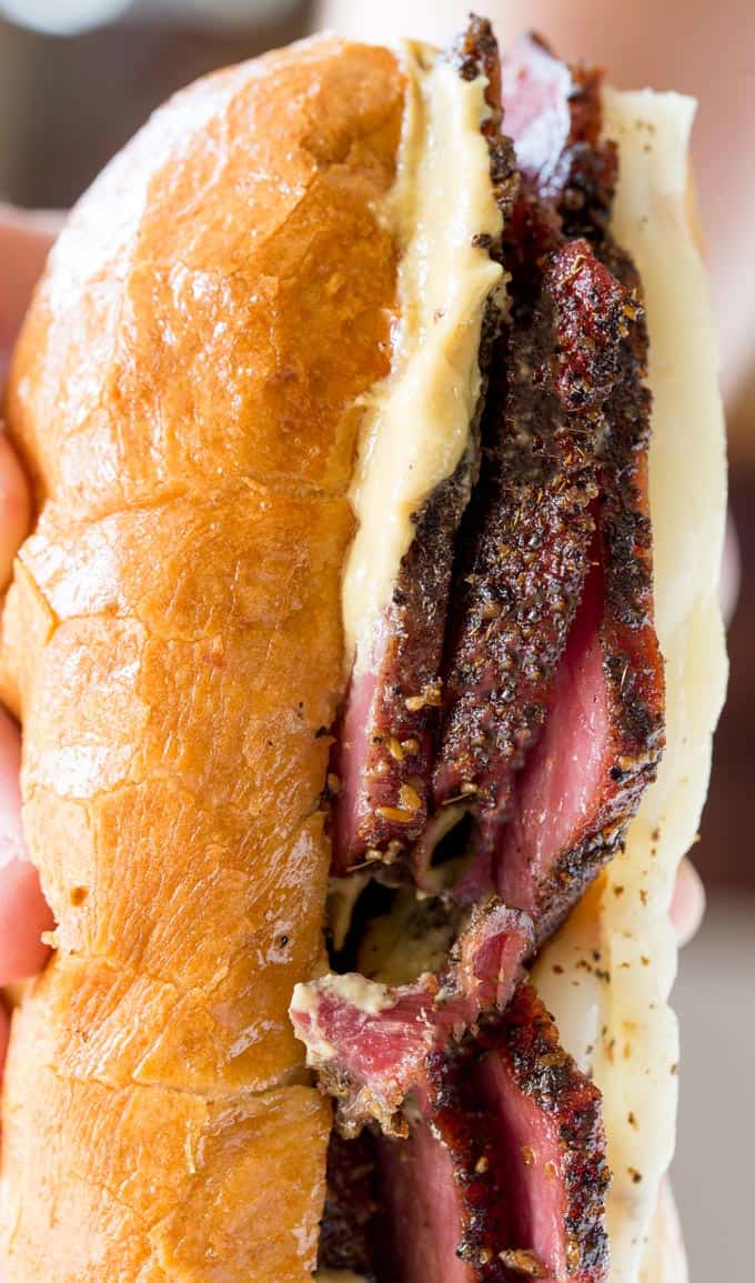 Slow Cooker Pastrami Sandwiches are easy to make for a crowd or for your lunches and takes just a few ingredients. You'll never buy deli pastrami again!