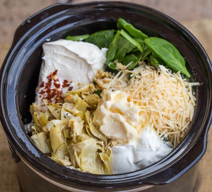 crockpot spinach dip ingredients in slow cooker