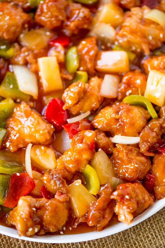 Sweet and Sour Chicken with crispy chicken, pineapple and bell peppers that tastes just like your favorite takeout place without the food coloring.