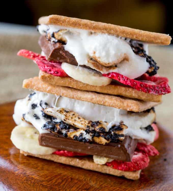 Banana Split S'mores are a crunchy, melty, sweet and tart summer treat with chocolate, graham crackers, marshmallows and freeze dried fruits.
