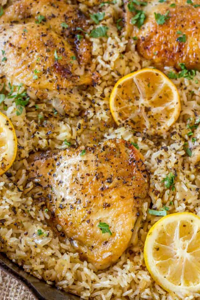 One Pot Greek Chicken and Rice with roasted lemon halves is a quick weeknight meal with garlic, lemon, and super flavorful seasoned rice pilaf.